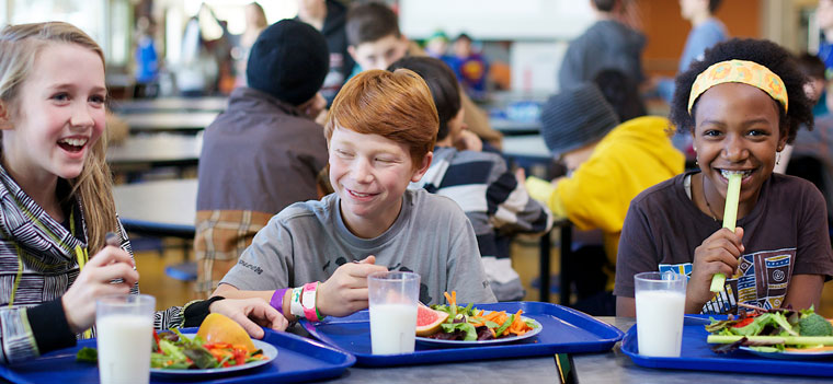 kids-three-laughing-at-table