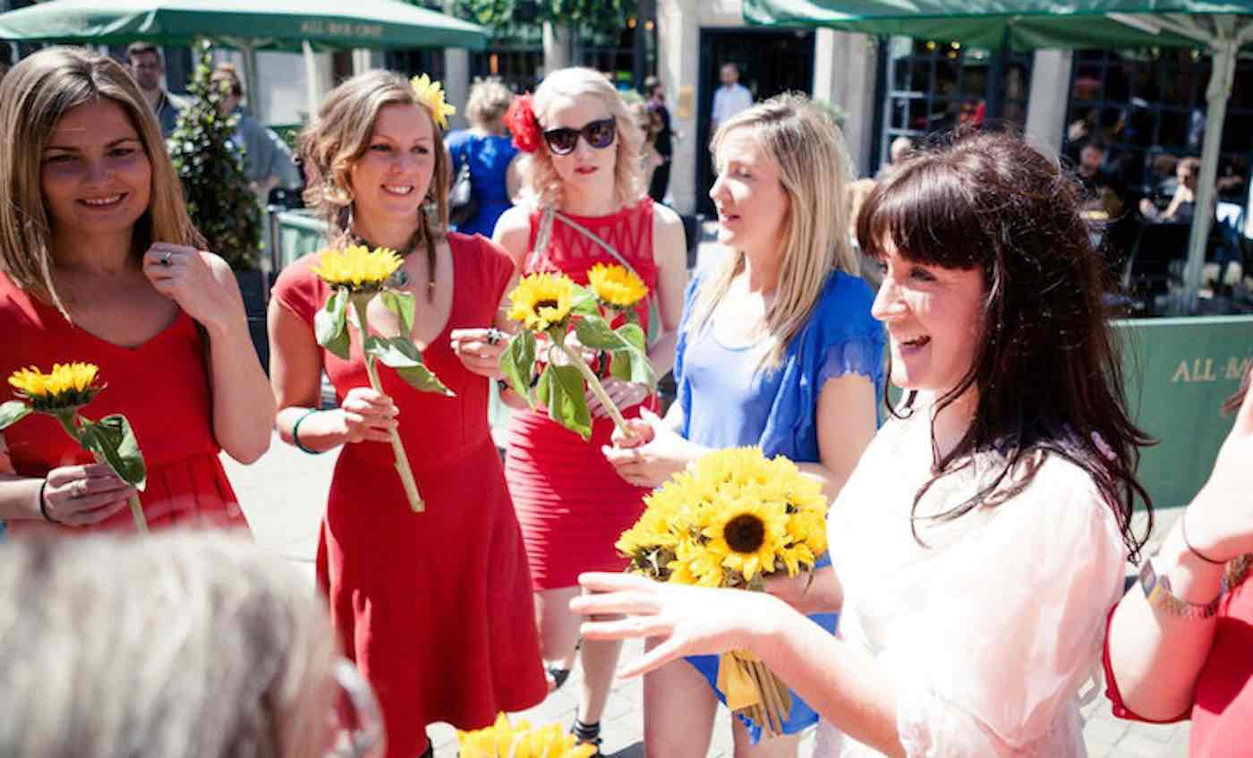 Sophie Tanner on her wedding day - to herself in 2015 at Brighton Fringe Festival in East Sussex. See SWNS copy NNbride: A woman celebrating her fourth wedding anniversary has written a book to explain the lifelong commitment she made when she got married to herself. Sophie Tanner tied the knot to herself four years ago wearing a vintage gown with a bouquet of sunflowers and was given away by her dad. The 40-year-old promised to embrace her dreams, accept her failures and be her own best friend as she declared her wedding vows to herself at Brighton Fringe Festival in East Sussex.