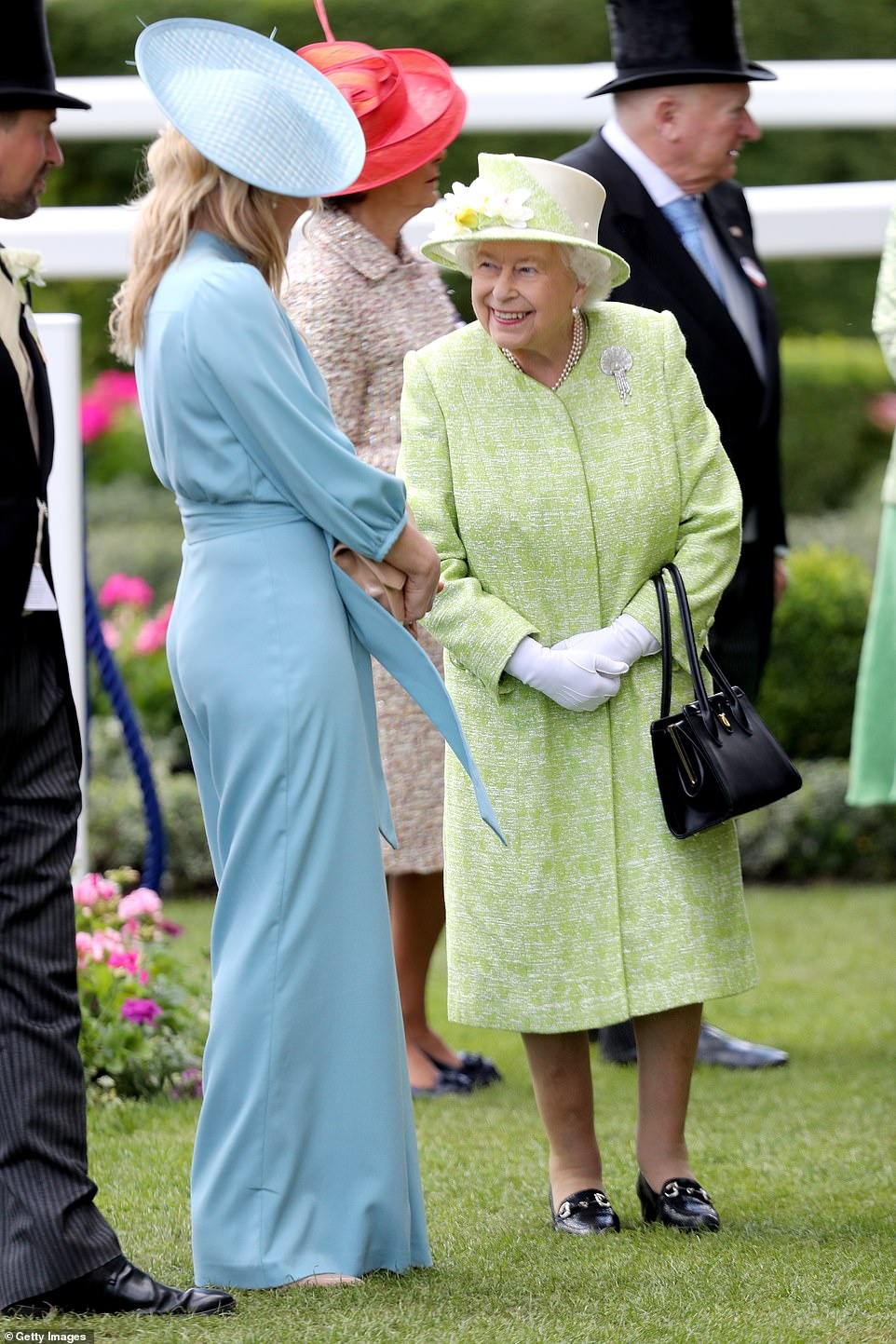 15124724-7988769-Autumn_Phillips_greets_Queen_Elizabeth_II_on_day_five_of_Royal_A-a-26_1581371937449.jpg