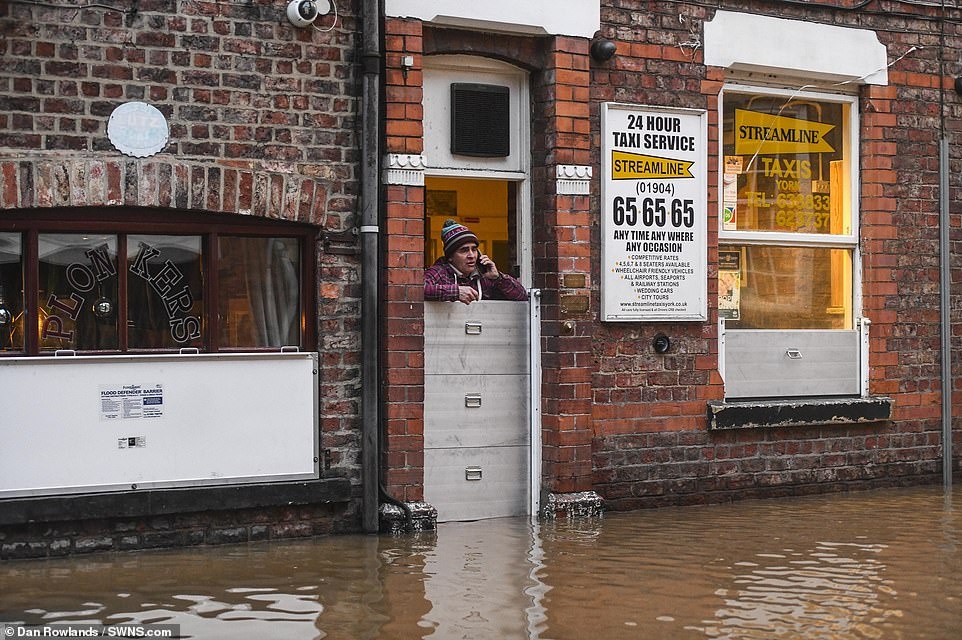 24890312-8015199-A_man_is_seen_trapped_into_his_taxi_business_building_in_York_af-a-87_1582048663068.jpg